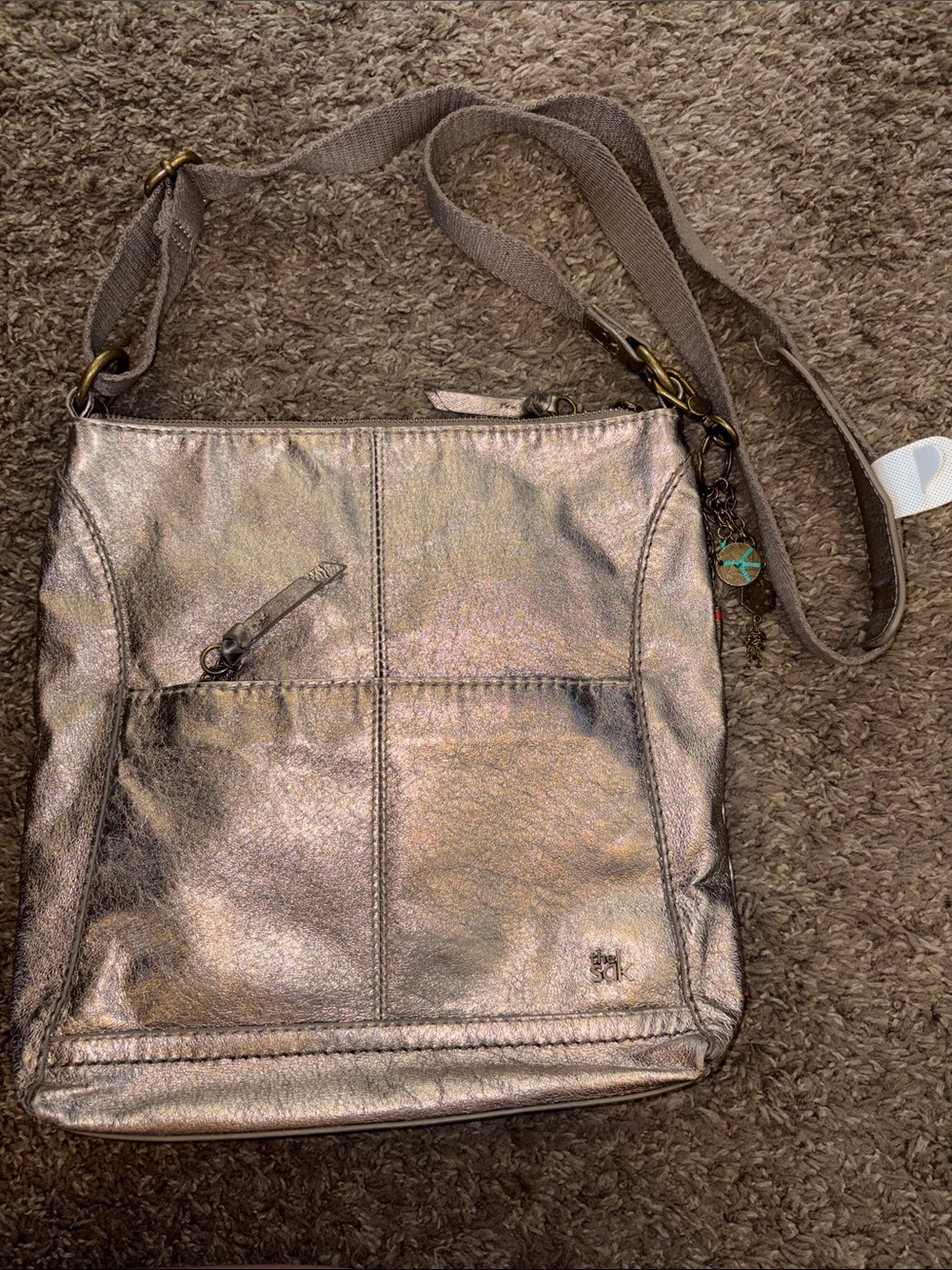 The Sak Metallic Taupe Crossbody Bag with Charm